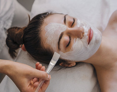 Woman getting a facial at a spa